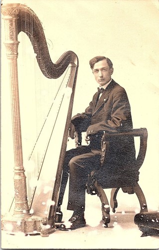 1912 rppc man playing ornate - man,