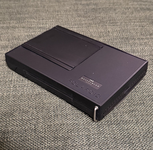 Polaroid 100 film back - back, for