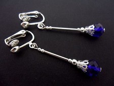 A PAIR OF DANGLY COBALT ROYAL BLUE  CRYSTAL SILVER PLATED CLIP ON EARRINGS.