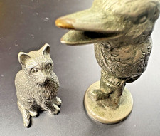 pewter cat and larger bird - old