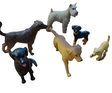 Selection of toy plastic dogs inc labradors and a schnauzer