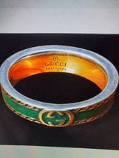 GUCCI RING. STERLING  SILVER 925 WITH GREEN ENAMEL AND 24ct GOLD PLATED DETAIL.
