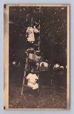 Little Kids Sitting on Orchard