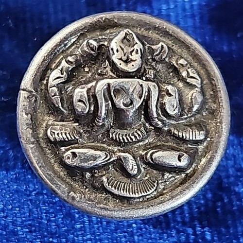 Silvertone amulet depicting - , a