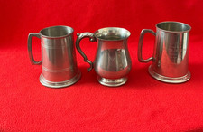 Three 1 pint pewter tankards
