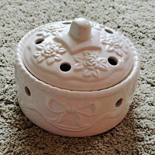White ceramic floral - pot, with