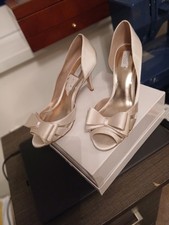 Ivory satin shoes, by Untold