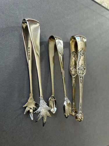 Three vintage sugar tongs