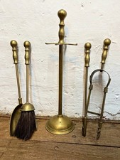 A Mid 20th Century Brass Fireside Companion Set