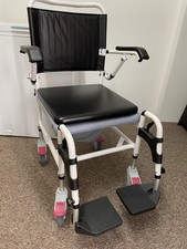 Brand New Commode On Wheels With padded Seat cushion & Arm rests In Black.