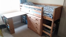 Child's FLEXA mid-sleeper cabin bed with chest of drawers and slide out desk
