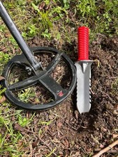 metal detecting digging hand