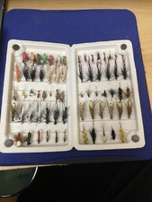 SNOWBEE FLYBOX OF ASSORTED TROUT FLIES.MOST UNUSED.  (191A)