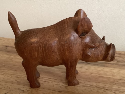 Hand carved wooden warthog - hand,