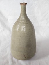 A tall celadon studio pottery