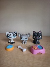 Littlest Pet Shops 3 dogs with 3 dog food accessories.