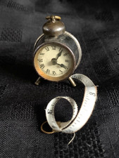 Antique Bedside Alarm Clock Novelty Cast Metal Rotary Tape Measure