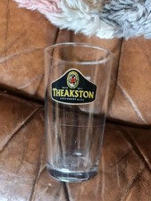 Theakstons half pint beer - half,