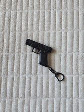 Black plastic gun keyring - gun,