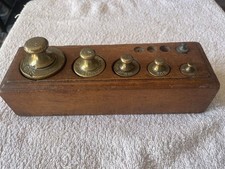 ANTIQUE BRASS WEIGHTS IN ORIGINAL WOODEN BLOCK UNPOLISHED