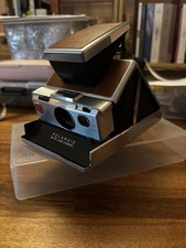 Polaroid SX-70 (brown) with one pack of expired SX-70 film (10/2019)