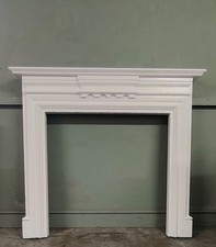 A Beautiful White Wooden Fireplace Mantle Surround