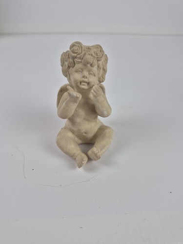 Seated cherub blowing kiss - seated,
