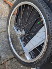 HOPE SILVER FRONT HUB MAVIC 717 DISC RIM 26" CONTINENTAL TYRE.