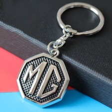 SILVER AND BLACK MG LOGO METAL