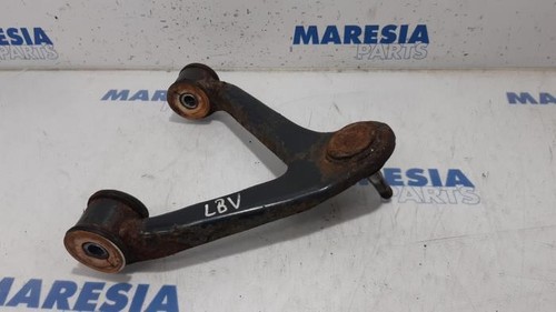 Left front upper control arm - front,