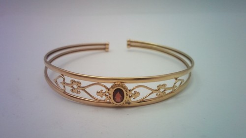 Gold torque bangle with a - 9,