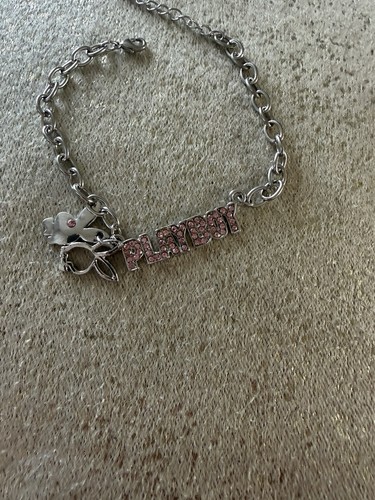Silver toned playboy bracelet - toned,
