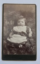 CDV OF INFANT ON A RUG, TARTAN