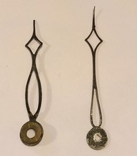 ## Pair Antique Steel Clock