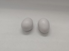 2 plastic egg shakers pair white hand instruments