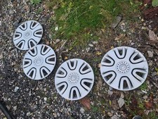 VAUXHALL AGILA B WHEEL TRIMS SET OF 4, FAIR CONDITION..