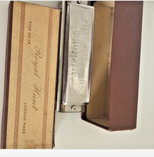 vintage "Bandmaster De Luxe Chromatic" harmonica.