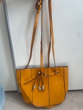 yellow zara handbag with gold detailing