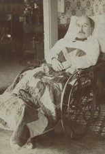 MAN W/ BOW TIE IN WHEEL CHAIR