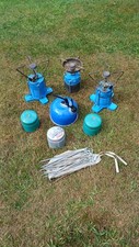 3 BLUE CAMPINGAZ STOVES 3 SPARE GAS CANISTERS 1 SMALL CAMPING KETTLE AND PEGS