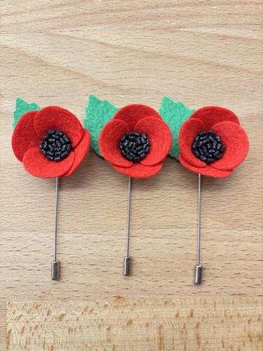 Three decorative red - red, felt