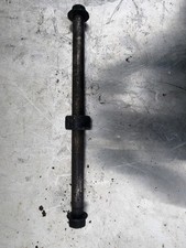 Rear wheel spindle axle for a