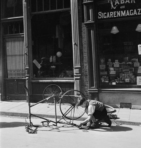 Boy repairing old fashioned - a,