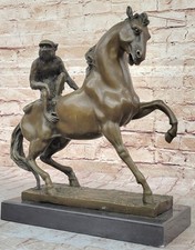 BRONZE MONKEY ON HORSE STATUE