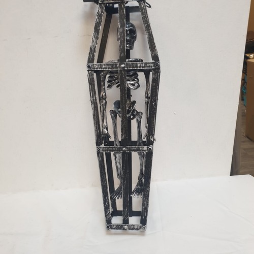 Hanging skeleton caged - skeleton,
