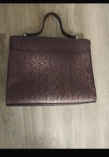 This GUESS Purse Is A Burgundy