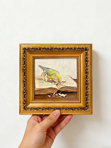 Parrot tearing old book pages - parrot,