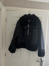 Unused ‘River island’ black faux leather/fur jacket. Size 18