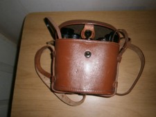 Vintage 8x25 binoculars in brown leather case. (E16)