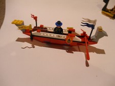 lego vintage red and white pirate sail boat with oars chest and minifigure